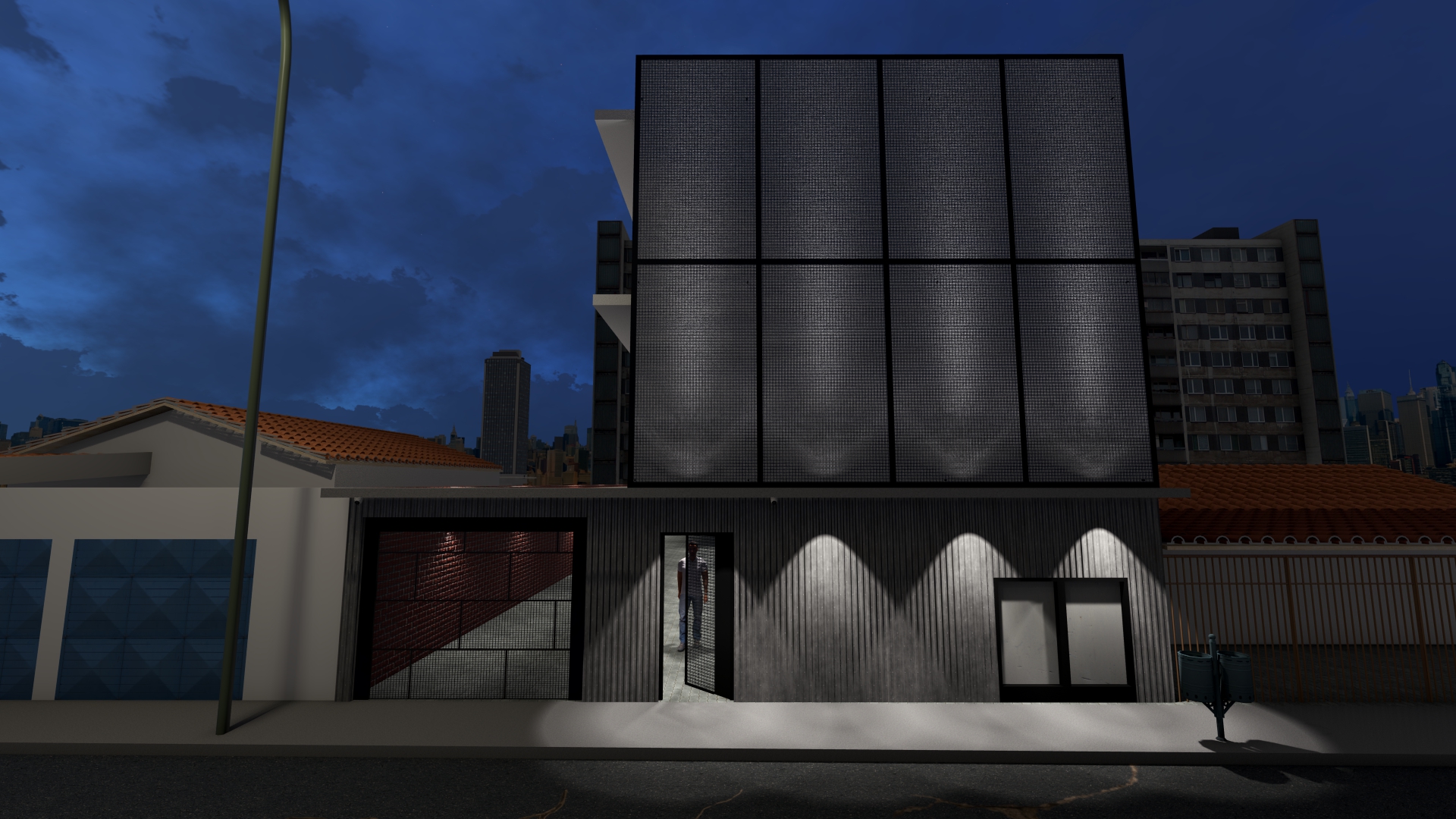 Fachada da rua em vista noturna.